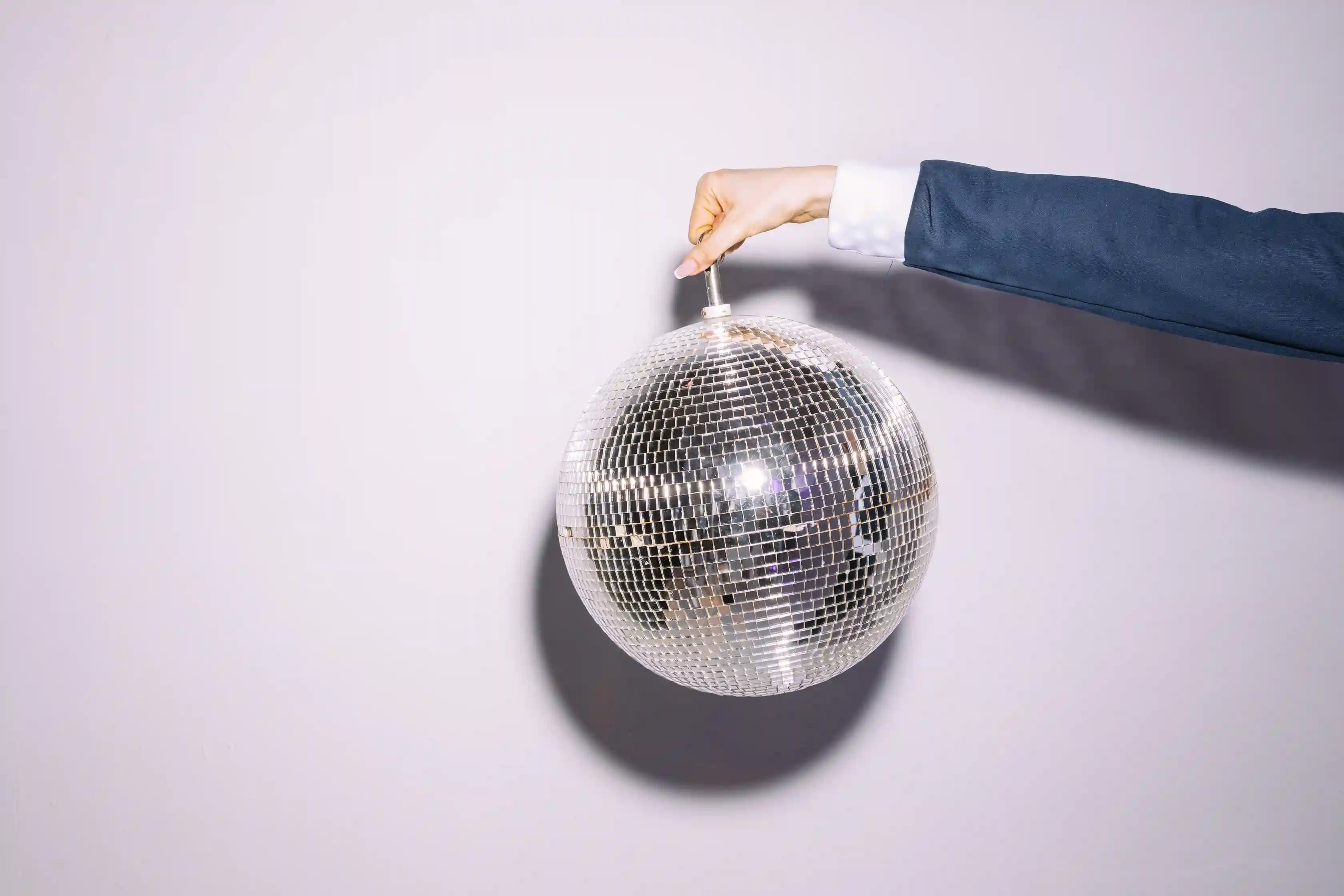 Victorian real estate agent holding a disco ball